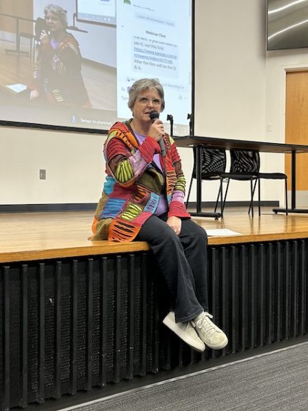 Denise Grupp-Verbon, School of Liberal Arts Internship Manager, leads the Oregon Road Film Series discussion of the film Rumble: Indians Who Rocked the World on November 15 in College Hall 100.