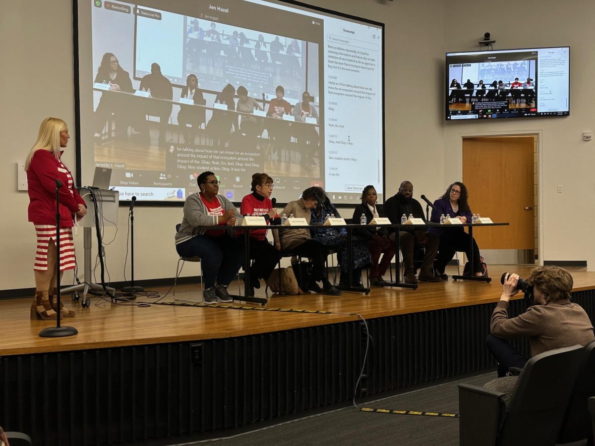 Led by Erin Kramer (standing), participants of the Gun Violence Survivors Panel share their grief and loss in College Hall 100 in an effort to bring greater awareness to the issue of gun violence.