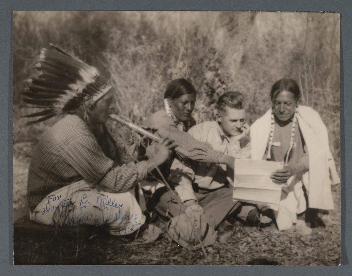 Thurlow Lieurance with three Native American Indians; one of whom plays a courting flute. Retrieved from the Library of Congress, 1922.