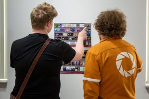 Students looking at the art in the Walter E. Terhune Art Gallery for the 2025 Student Art Show.