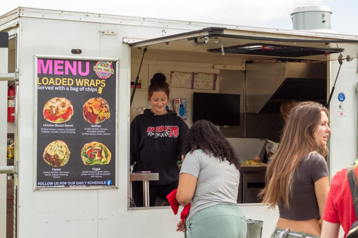 Students wait in line at the food truck for wraps at Fall Fest.