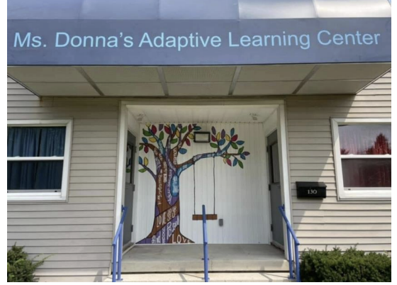 The front of Ms. Donna's Adaptive Learning Center. The tree is painted by one of the school's teachers.