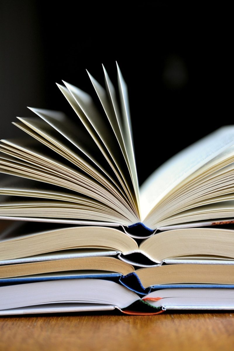 Several books in a pile are a readers dream. Retrieved from Pixabay.